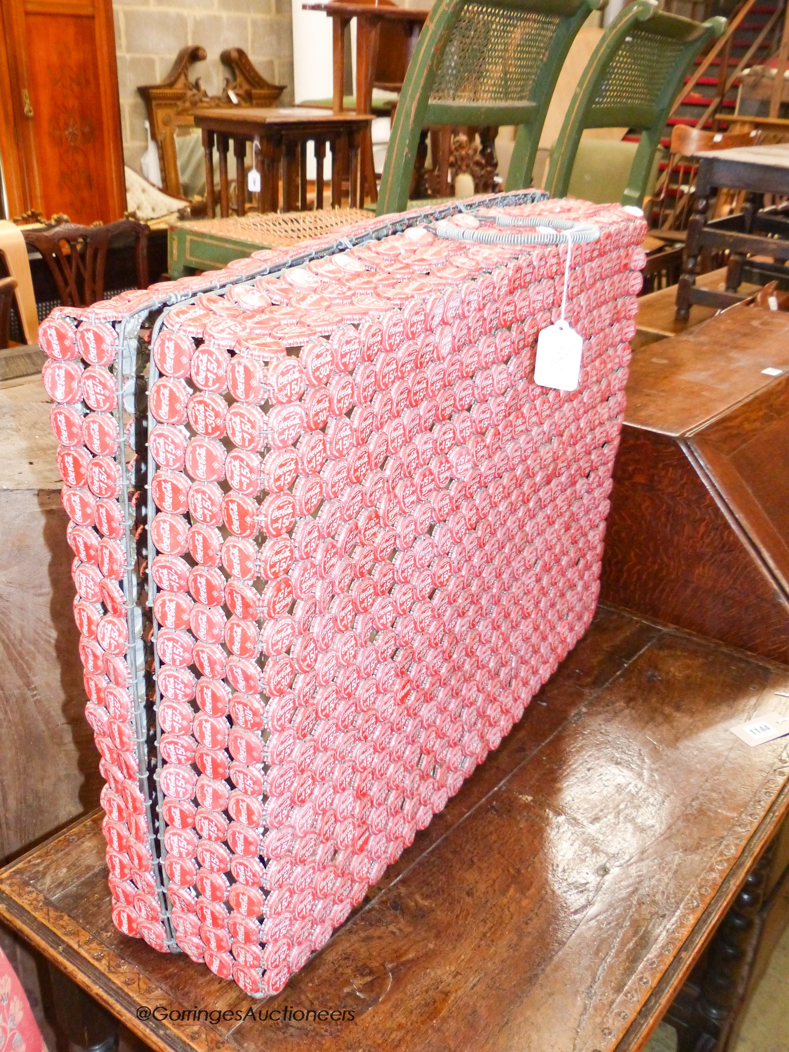 An unusual wirework suitcase, made from vintage Coca Cola bottle caps, 51 x 71cm.